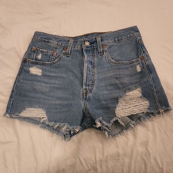 Medium wash distressed button fly, high waist Levi's shorts size 27. - Picture 1 of 9